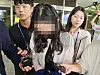A teacher, who faces arrest on charges including unlawful entry into a school building during the exam period, leaves the Andong Branch of the Daegu District Court on July 14 after attending a pretrial detention hearing. [YONHAP]