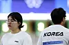 Korea's Oh Ye-jin, left, and Lee Won-ho react during the 10-meter air pistol mixed team qualification round at the Paris Olympics in Chateauroux, France on Monday. [XINHUA/YONHAP]