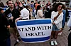 Protesters including Israelis residing in Japan, hold ″Stand-with-Israel″ rally demanding immediate release of all hostages captured during the ongoing conflict with Hamas, in front of Shibuya station in Tokyo, Japan, on Wednesday. [REUTERS/YONHAP]