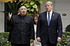 U.S President Donald Trump, right, and North Korean leader Kim Jong-un take a walk after their first meeting at the Sofitel Legend Metropole Hanoi hotel, in Hanoi, Vietnam on Feb. 28, 2019. [AP/YONHAP]