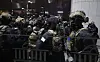 Soldiers prepare to enter the National Assembly building around midnight Wednesday after President Yoon Suk Yeol declared emergency martial law late Tuesday night. [YONHAP]