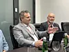 Arkadiusz Tarnowski, deputy director at the Polish Investment and Trade Agency (PAIH), left, and Piotr Placha, key expert for the export goods sector at PAIH, speak during MSPO 2025 in Kielce, Poland. [SEO JI-EUN]