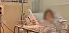 A woman surnamed Kim is seen in a hospital in Guam after giving birth via cesarean section in this image taken from Korean broadcaster MBC's report. [SCREEN CAPTURE]