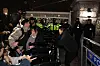 Officials at the National Assembly try to enter the building as police block the entrance late Tuesday night after President Yoon Suk Yeol declared emergency martial law. [JOONGANG ILBO]