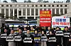 Lawmakers from the liberal Democratic Party hold up placards demanding President Yoon Suk Yeol's dismissal in front of the Constitutional Court in Jongno District, central Seoul, on March 20. They stand in front of posters calling on the court to reinstate the president. [YONHAP]