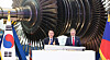 Korean President Yoon Suk Yeol, left, and Czech Prime Minister Petr Fiala clap after signing a turbine blade at Doosan Skoda Power in the Plzen industrial park in the Czech Republic on Friday. [JOINT PRESS CORPS]