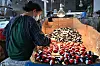 An employee works at a toy factory specialized in solar-powered plastic gadgets in Yiwu of Zhejiang Province on April 11. [AFP/YONHAP]