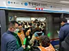 Activists under the Solidarity Against Disability Discrimination (SADD) protest at Hansung University Station, Seoul Metro Line No. 4, during the morning rush hour on Nov. 12. [YONHAP]