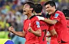Korea's Paik Seung-ho, left, celebrates scoring during a 2022 Qatar World Cup round of 16 match against Brazil at Stadium 974 in Doha, Qatar on Dec. 6, 2022. [YONHAP]