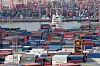 Containers are stacked at a port in Busan. [YONHAP]