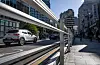 Cars pass by the steel fencing newly installed at the site of the fatal car accident near City Hall in downtown Seoul on Tuesday. The accident in July resulted in nine deaths. [NEWS1]
