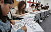 International students practice writing Korean at Dongseo University's Institute of Foreign Language Education on April 22. [YONHAP]