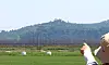 Residents of Dangsan-ri in Songhae-myeon, Ganghwa County, Incheon, point toward loudspeakers set up on a hillside in North Korea’s Gaepung County on June 12. The speakers, used for anti-South propaganda broadcasts, appeared to have been turned off in response to Seoul halting its loudspeaker broadcasts toward the North. [YONHAP]