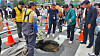 District officials and safety personnel conduct a recovery effort to fill up a sinkhole that appeared in Mapo District in western Seoul in April. [NEWS1]