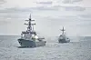 The ROKS Sejong the Great destroyer, left, and the ROKS Dae Jo Yeong destroyer engage in live-fire drills at an unspecified location during a major maritime exercise from Feb. 25-27, 2025. [NAVY]