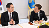 President Lee Jae Myung, right, listens to remarks by Samsung Electronics Executive Chairman Lee Jae-yong during a meeting with major business associations and corporate leaders at the presidential office in Yongsan District, central Seoul, on June 13. [JOINT PRESS CORPS]