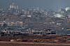 Israeli soldiers operate in Gaza, as seen from the Israeli side of the Israel-Gaza border on July 9. [REUTERS/YONHAP]