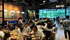 Customers eat fried chicken and other Korean food at a Genesis bb.q store in the Philippines in this undated photo. [GENESIS BBQ]