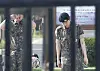 Jin is spotted walking out just before 9 a.m. on Wednesday from the ROK Army 5th Infantry Division Recruit Training Center in Yeoncheon County, Gyeonggi. [NEWS1]