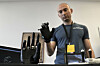Ryan Saavedra, CEO of Alt-Bionics, operates a bionic hand at the first International Humanoid Olympiad at the Olympic Academy, in ancient Olympia, Greece, on Sept. 1. [AP/YONHAP]