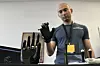 Ryan Saavedra, CEO of Alt-Bionics, operates a bionic hand at the first International Humanoid Olympiad at the Olympic Academy, in ancient Olympia, Greece, on Sept. 1. [AP/YONHAP]