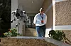 The Unitree Go2 robot called Pluto jumps from a platform as the Kiefer marketing communication manager Klaountia Koule looks on during the first International Humanoid Olympiad at the Olympic Academy, in ancient Olympia, Greece, on Sept. 1. [AP/YONHAP]
