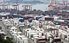 Trade containers are stacked at Busan Port on Aug. 11. [NEWS1]