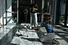A girl gives her hand to the Unitree Go2 robot called Pluto at the first International Humanoid Olympiad at the Olympic Academy, in ancient Olympia, Greece, on Sept. 1. [AP/YONHAP]