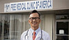The late Dr. Tom Kim is pictured next to a clinic he founded that provides free health care. [SCREEN CAPTURE]