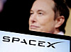 SpaceX's logo and an Elon Musk photo are seen in this illustration created on Dec. 19, 2022. [REUTERS/YONHAP]