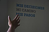 A health worker gestures towards a message that reads in Spanish; ″My decisions, my road, my steps″ during a tour of the MSI Foundation, an organization that offers information and help to women seeking abortions, in Mexico City, May 8. [AP/YONHAP]