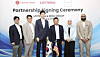 Shin Yoo-yeol, third from left, executive vice president of the Future Strategy Office at Lotte, and Serai Group Chairman Najib Hamid, fourth from left, pose for photos with other officials after signing a partnership agreement for the launch of Lotte GRS' Lotteria burger chain in Malaysia at the Lotte World Tower in Jamsil, southern Seoul, on Aug. 6. [YONHAP]