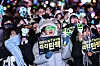 Protesters cheer with light sticks and placards in a rally after the impeachment of President Yoon Suk Yeol was passed in parliament near the National Assembly in western Seoul on Dec. 14. [JOONGANG ILBO]