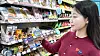 A woman holds a Japanese-imported ″Hokkaido Pudding″ at a GS25 convenience store. [GS25]