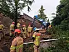 Firefighters respond after a retaining wall under an overpass collapsed and crushed a vehicle passing beneath at the Gajang Interchange in Osan, Gyeonggi, on July 16. [GYEONGGI FIRE AND DISASTER HEADQUARTERS]