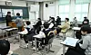 Students at a high school in Jongno District, central Seoul, receive their report cards on Dec. 6, 2024. [NEWS1]