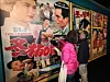 Visitors view the cover of singer Lee Mi-ja’s 1964 hit “Dongbaek Agassi,” which translates to “Camellia Lady,” displayed at Busan Modern & Contemporary History Museum in Busan on Oct. 23, 2024. [SONG BONG-GEUN/JOONGANG PHOTO]