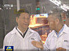 Chinese President Xi Jinping, left, listens to a briefing by Yangtze Memory Technologies then-CEO Simon Yang in 2018. [YMTC]