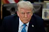 U.S. President Donald Trump talks to reporters after signing an executive order, 'Unleashing prosperity through deregulation,' in the Oval Office on Jan. 31, in Washington. [AFP/YONHAP]
