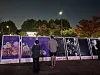 People read display boards explaining the Itaewon crowd crush during a memorial event held near City Hall in central Seoul on Saturday. [CHO JUNG-WOO]
