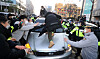 Residents of Ansan, Gyeonggi, try to block a government-owned vehicle carrying convicted child rapist Cho Doo-soon to his home in the city upon his release from prison on Dec. 12, 2020. [YONHAP]