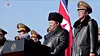 North Korean leader Kim Jong-un, center, speaks during a visit to the Ministry of National Defense on the occasion of the 78th anniversary of the founding of the Korean People’s Army, also known as Army Day, on Feb. 8. [RODONG SINMUN]