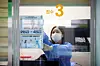 A medical worker posts a notice on the window of a testing booth at a Covid-19 screening clinic located in Gwangju's Buk District in 2023. [GWANGJU BUK DISTRICT OFFICE]