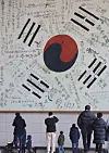 A massive Korean national flag signed by the independence fighter during the Japanese colonial era hanging on the Independence Hall of Korea in Cheonan, South Chungcheong on Sunday ahead of the 104th anniversary of the March 1 independence movementsm 2023. The movement that started on the nation’s capital on March 1, 1919 with 33 Korean leaders’ Proclamation of Independence spread to other regions of the country to demonstrate against the Japanese occupation. [YONHAP]