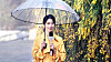 A scene from Netflix hit ″The Glory″ (2022-2023) shows its main antagonist Park Yeon-jin, played by Lim Ji-yeon, delivering the weather news in a rain coat. [SCREEN CAPTURE]
