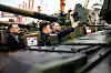 Polish Defence Minister Mariusz Blaszczak, left, Minister of South Korea's state arms procurement agency Eom Dong-hwan, center, and Polish President Andrzej Duda look at tanks during the acceptance of the first Korean K2 battle tanks and K9 howitzers for Poland at the Baltic Container Terminal in Gdynia on December 6, 2022. [AFP/YONHAP]