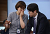 Kim Hyun-ji, left, the presidential secretary of general affairs, speaks with Ha Jung-woo, right, senior presidential secretary for AI policy and future planning, during a meeting of senior presidential aides at the presidential office in Seoul on Sept. 11. [YONHAP]