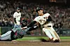 San Francisco Giants outfielder Lee Jung-hoo, right, is tagged out at home plate by Miami Marlins catcher Nick Fortes during an MLB game at Oracle Park in San Francisco, California on June 25. [REUTERS/YONHAP]