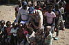 Britain's Prince Harry playfully teases a child during a safety class for children as part of his visit to see the work of landmine clearance charity of the Halo Trust, in Cuito Cuanavale, Cuando province, southern Angola, July 16. [AP/YONHAP]