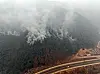 Smoke billows from a mountain range near Andong, North Gyeongsang as wildfires swept the region on March 26. [NEWS1]